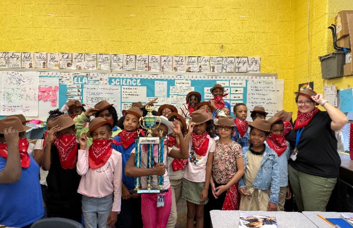  4th grade students celebrating their achieving goal in iReady test goal in their western wear.